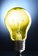 Color light bulb on dark background