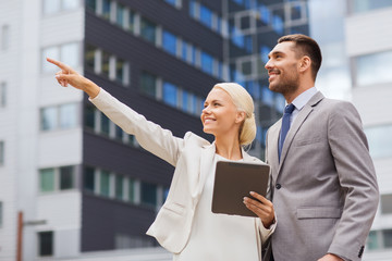 Sticker - smiling businessmen with tablet pc outdoors