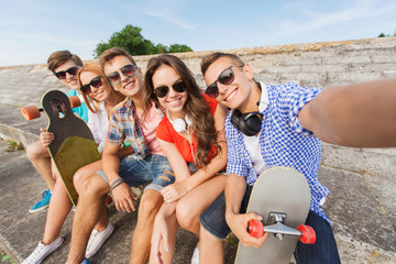 Sticker - group of smiling friends with smartphone outdoors