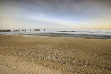 Fototapete - Morze,  plaża o wschodzie słońca