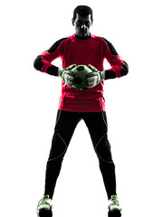 Wall Mural - caucasian soccer player goalkeeper man  holding ball silhouette