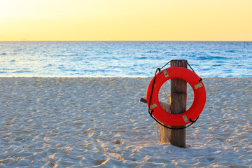 Life preserver on sandy beach