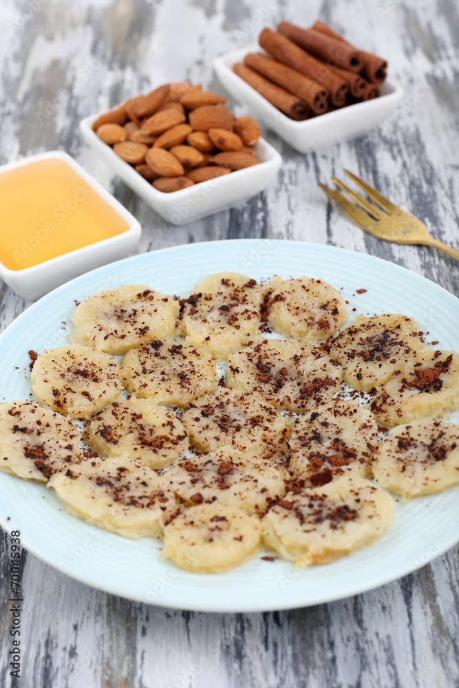 Sweetened fried banana on plate, close-up