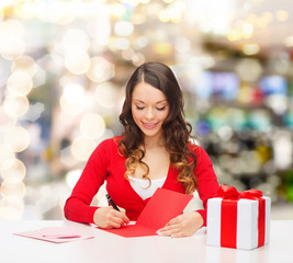 Sticker - smiling woman with gift box writing letter