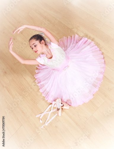 Fototapeta na wymiar small ballerina at dancing school