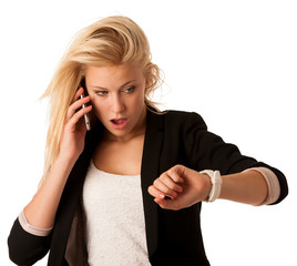 Sticker - Young blonde woman looks at her watch when she is being late iso