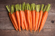 © Natika - fresh carrot bunch on grungy wooden background