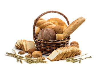 assortment of baked bread in basket on white background