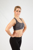 Fototapeta  - Blond woman in exercise outfit, looking at the camera