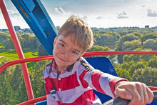 European Boy On A Ferris Wheel