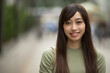 © blvdone - Young Asian woman in city