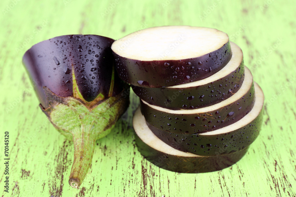 Chopped aubergines on wooden background