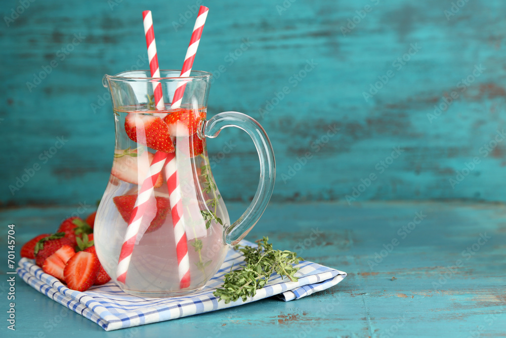 Tasty cool beverage with strawberries and thyme,