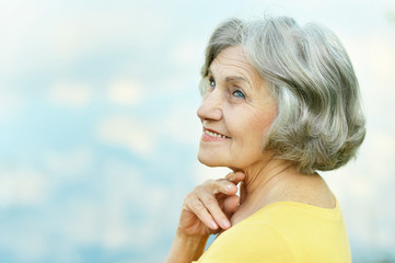 Wall Mural - Old woman enjoying a walk