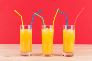 Sticker - Orange juice on wooden table.