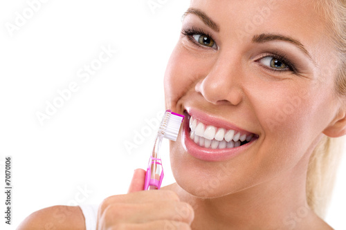 Cuadros en Lienzo Dientes de la mujer que sostienen el cepillo de dientes cepillado