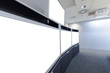 © PinkBlue - Empty Video Conference Room with isolated white screen