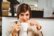 © WavebreakmediaMicro - Pretty businesswoman enjoying her coffee