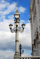 Vintage street lights decorated by crosses. Taken in Moscow.