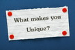 The question What Makes You Unique? on a blue notice board