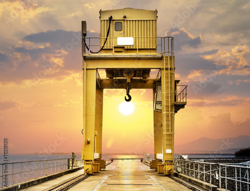 Fototapeta na wymiar Large Gantry Crane on Sunset