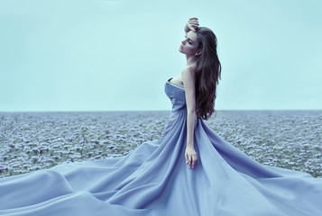 Wall Mural - Beautiful woman wearing blue dress