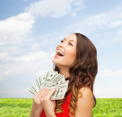 woman in red dress with us dollar money