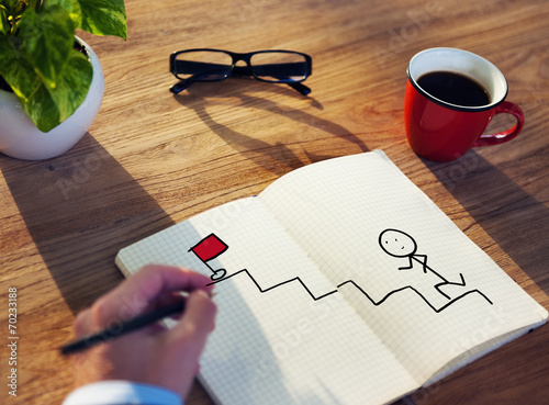 Fotografie, Obraz Businessman Drawing Goal Concept on a Note Pad