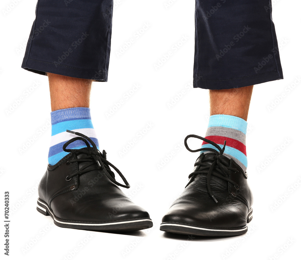 Man leg in suit and colorful socks, isolated on white