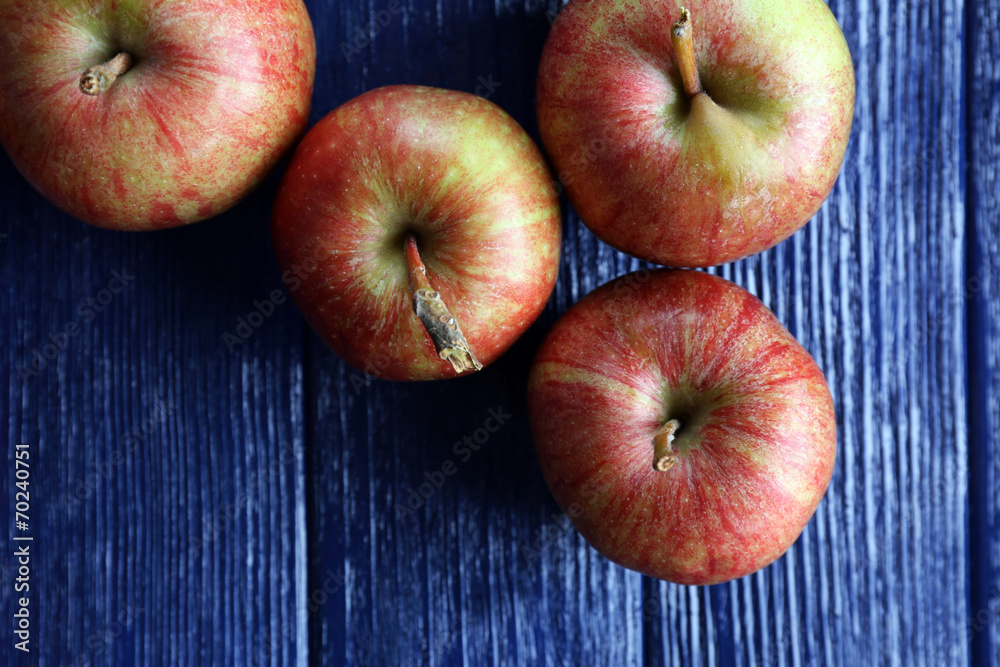 Juicy apples on wooden table, close-up