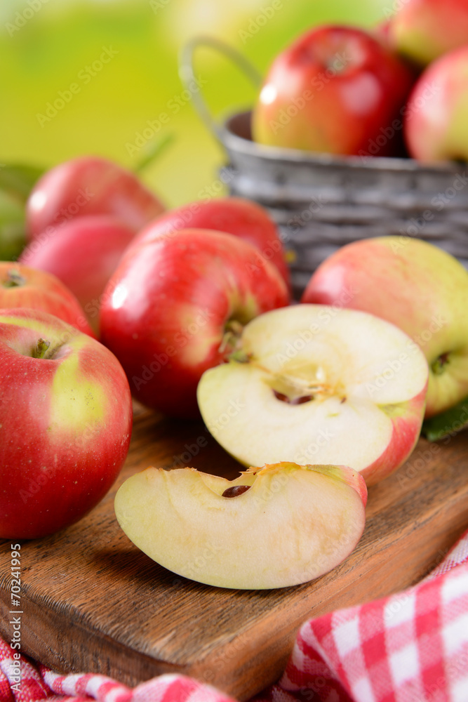 Sweet apples  on table on bright background