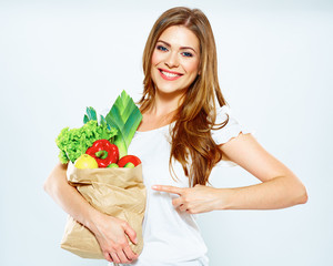 Wall Mural - woman with green food points a finger at the product