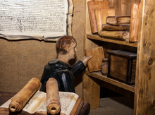 Statue Of Monk In The Monastery Library