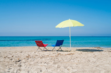 Wall Mural - Beach umbrella and lounge chairs