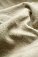 Wall Mural - Close up of beige material on clothing.