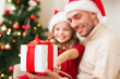 © Syda Productions - close up of father and daughter with gift box