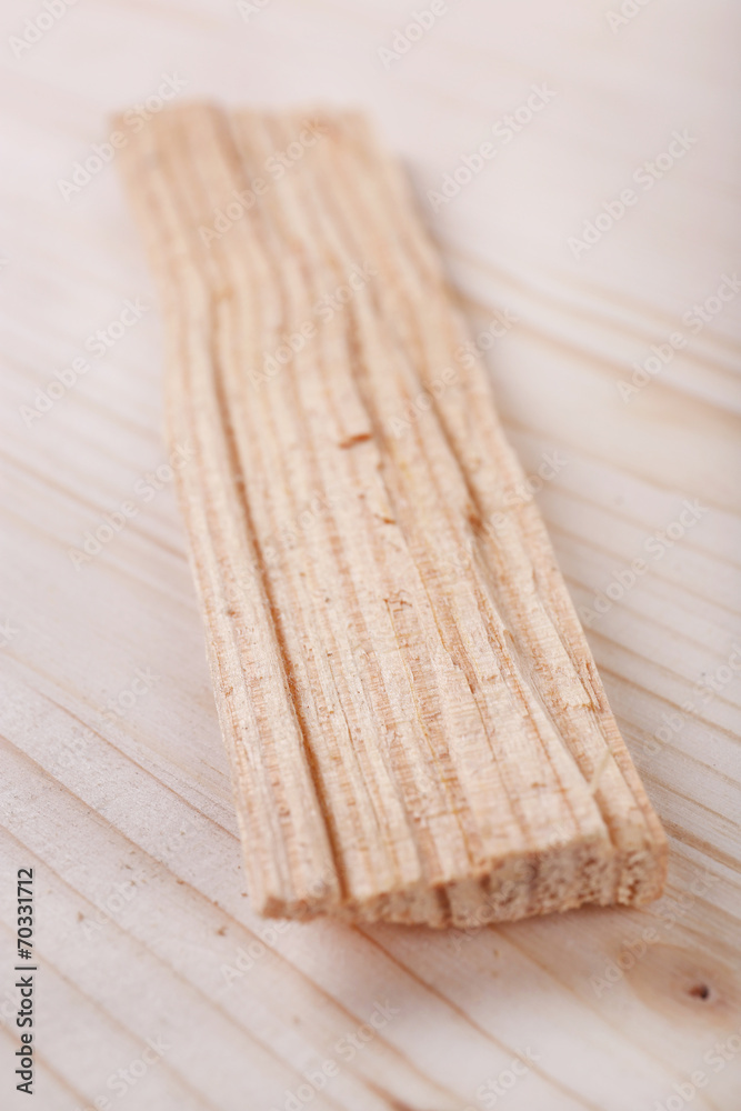 Wood shavings on wooden background