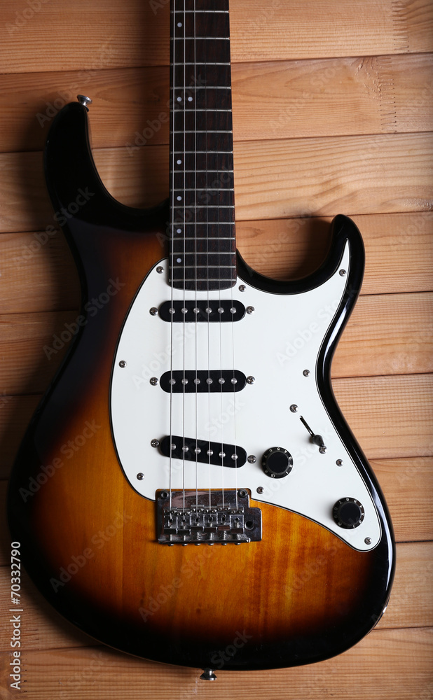 Guitar on wooden background