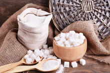 Refined Sugar In Bag And Bowl On Wooden Background