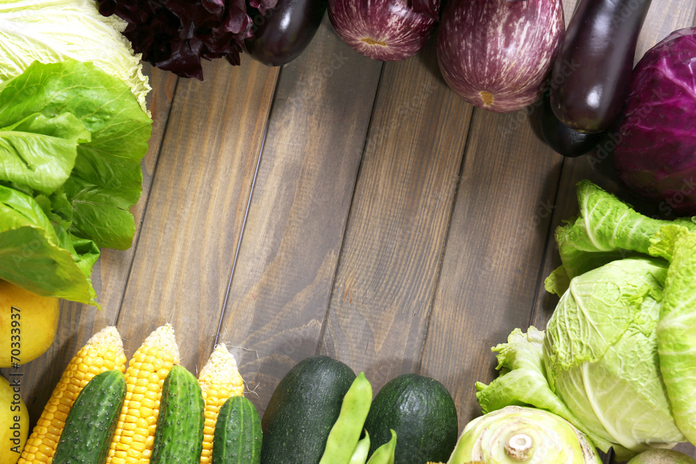 Fresh organic vegetables on wooden table, close up