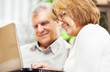 © milanmarkovic78 - Senior couple using laptop