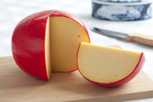 Edam Cheese On A Cutting Board