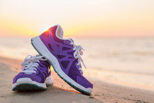 Pair Of Sports Shoes On The Beach