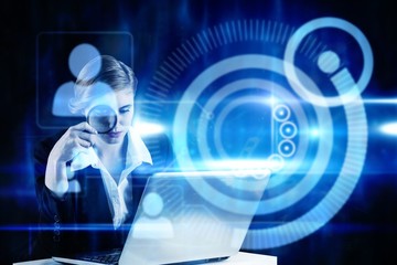 Leinwandbilder - Composite image of redhead businesswoman using her laptop