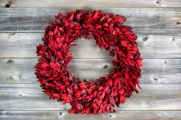 Poster - Natural leaf wreath for the seasonal holidays on rustic wood