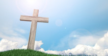 Crucifix On A Grassy Hill And Blue Sky