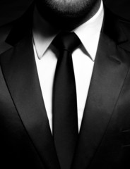 man gentleman in black suit and tie