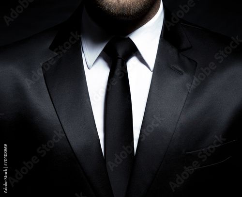Cuadros en Lienzo Man gentleman in black suit and tie