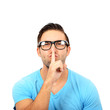 © irishmaster - Portrait of man with gesture for silence against white backgroun