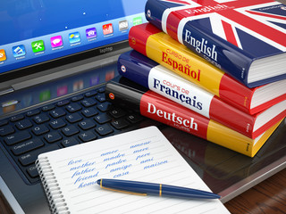 Poster - E-learning. Learning languages online. Dictionaries  on laptop.